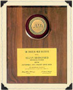 Text describing Bridgford Foods product lines and company overview next to a framed wooden award plaque.