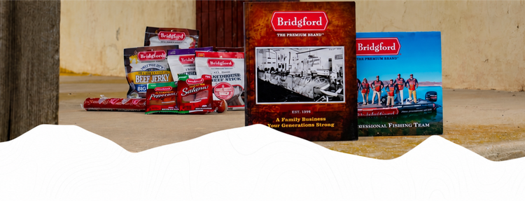 Bridgford meat snacks alongside promotional booklets on a ledge