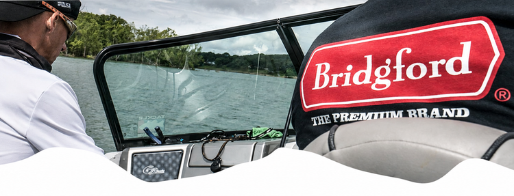 Person on a boat with a Bridford branded canopy