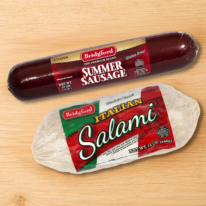 Bridgford Summer Sausage and Italian Salami chubs on wooden surface